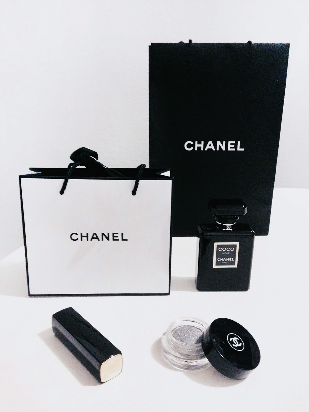 Chanel-packages-flatlay-monochrome