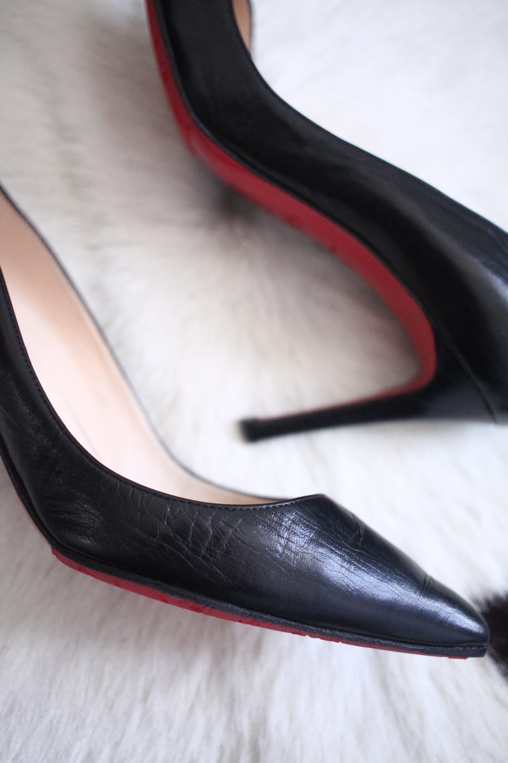 Christian Louboutin black Pigalle heels point red